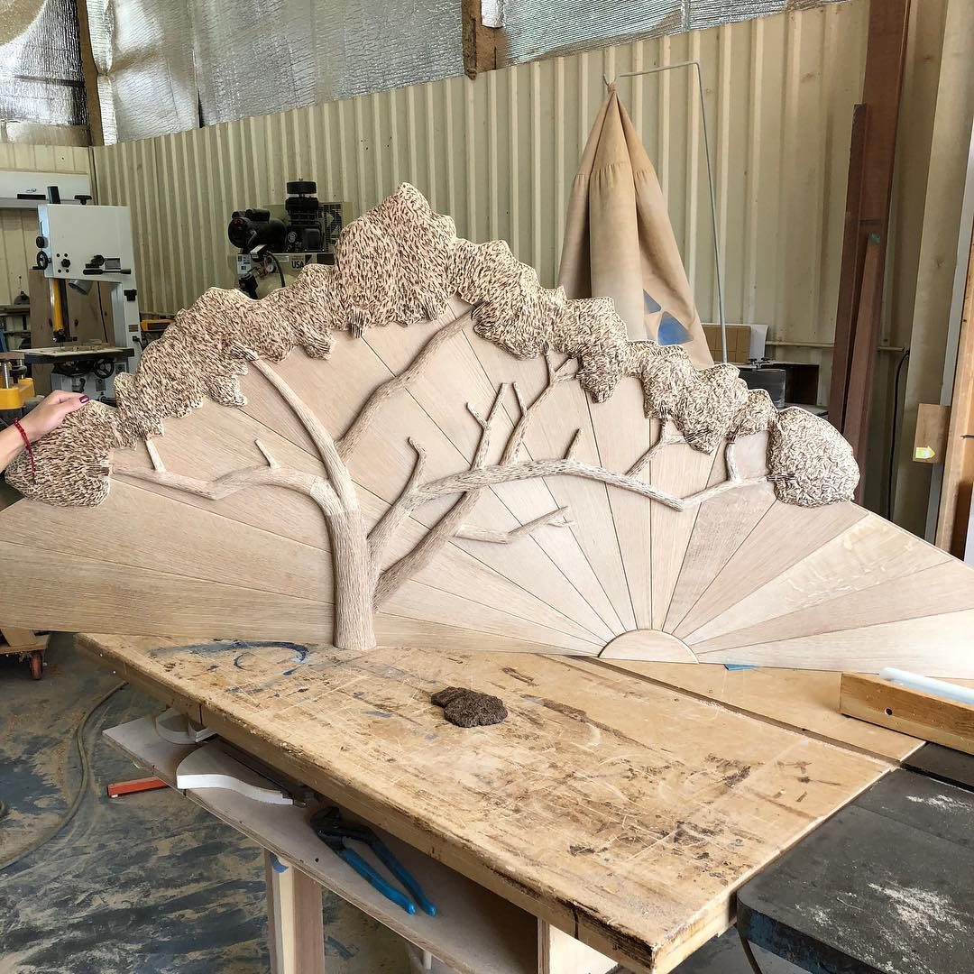 Large hand-carved relief panel of a tree with a full canopy