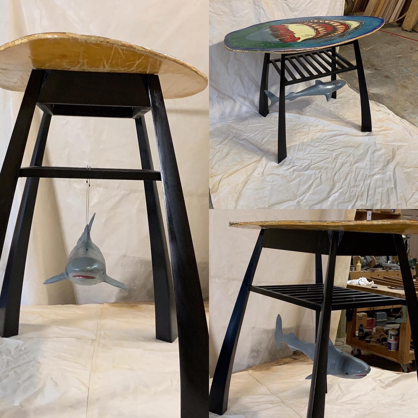 Tall table with a surfboard-shaped top and a carved shark below