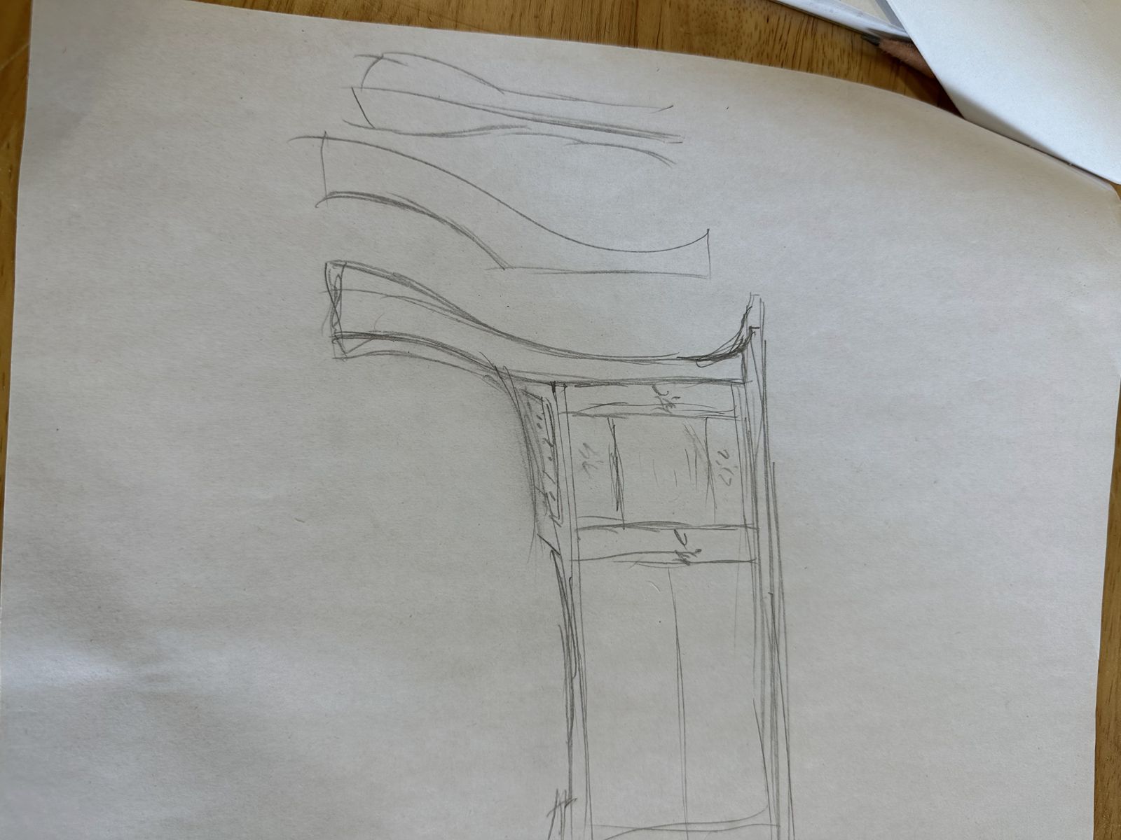 Pencil sketch of curved top and leg profiles